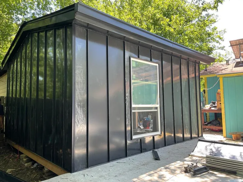 Black standing seam metal wall panels for Roof Inspection in Delray Beach