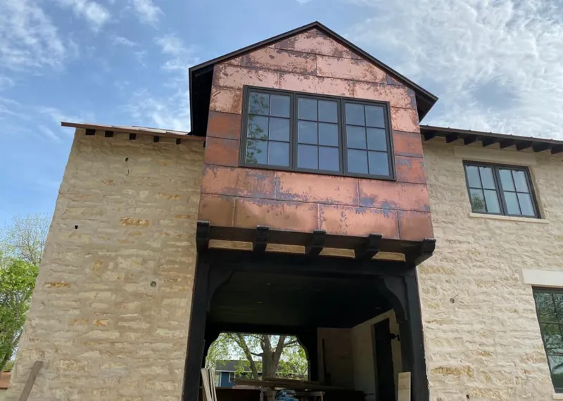 Copper metal panel facade on a stone building for Metal Roof Coating in Delray Beach