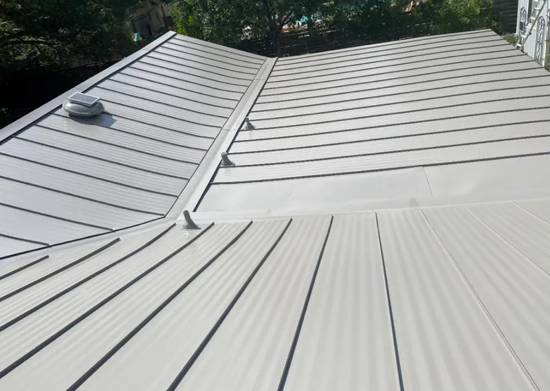 Solar attic fan installed on a metal roof for Roof Ventilation in Delray Beach